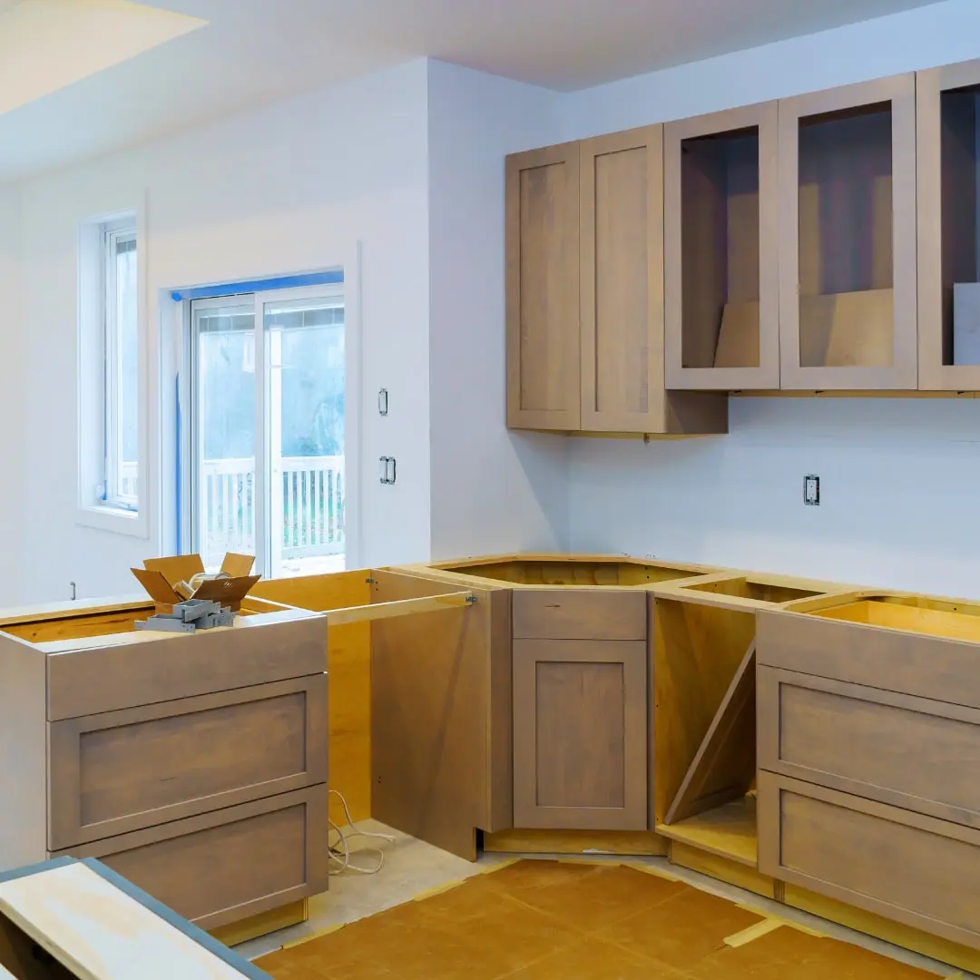 Kitchen cabinets being installed during a remodel
