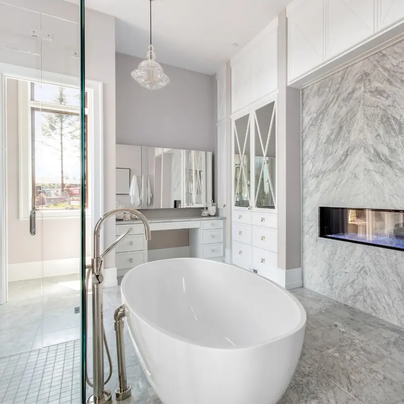 Marble-tiled bathroom with a deep soaking tub
