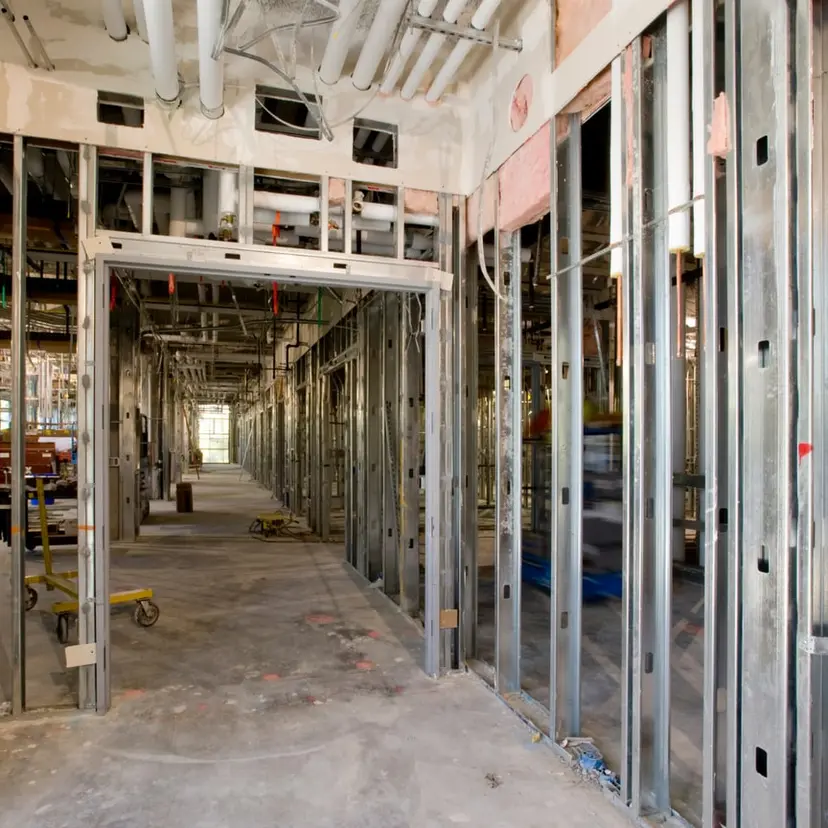 Interior steel-stud wall framing going up inside a commercial space