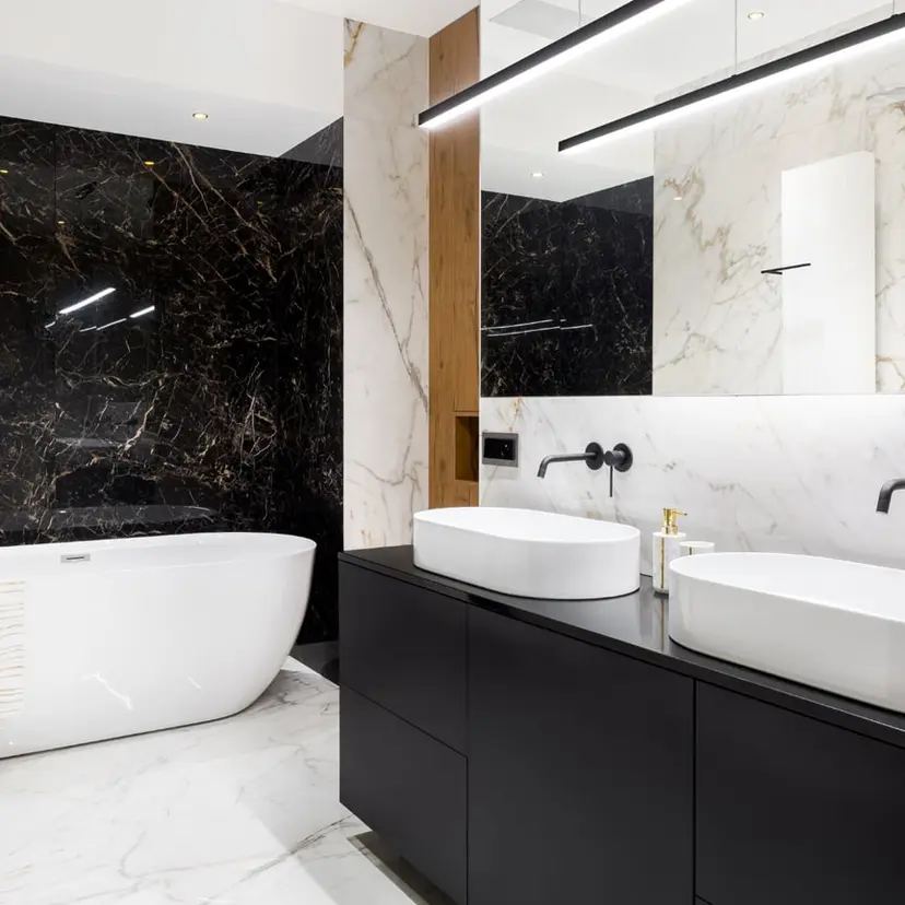 Modern bathroom with a black vanity and freestanding tub in a Denham Springs-area remodel