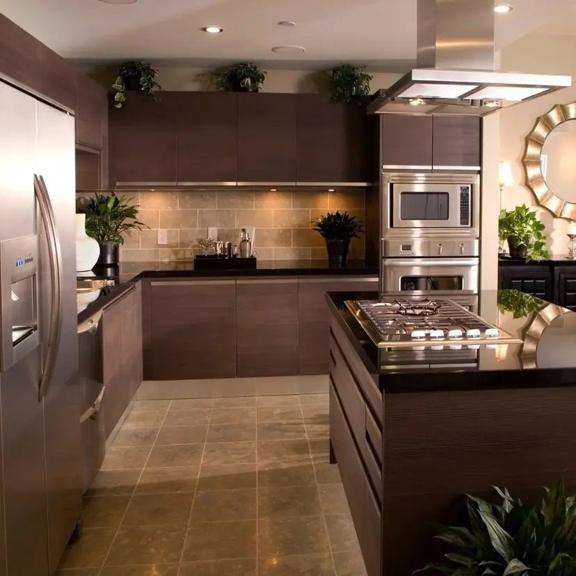 Dark wood kitchen with stainless appliances in a remodeled Metairie home