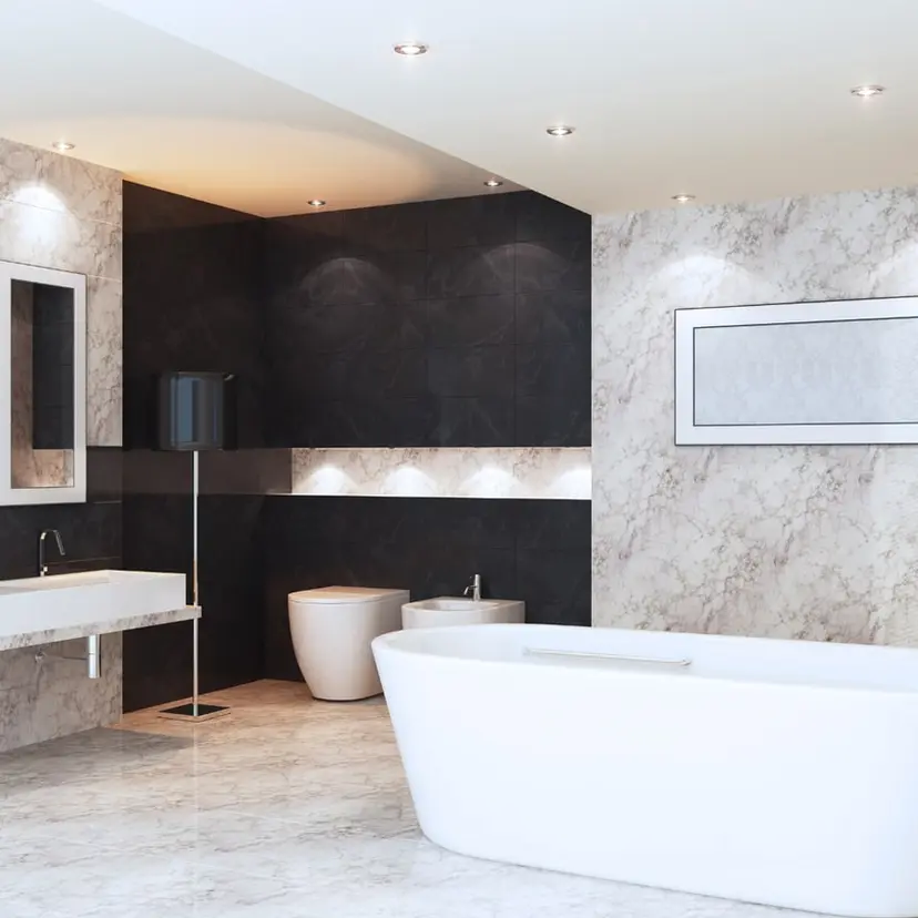 Dark tile bathroom with a white soaking tub in a renovated New Orleans home
