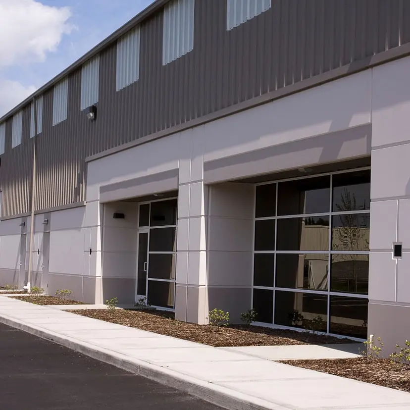 Grey metal commercial warehouse building of the kind built for Port Allen businesses