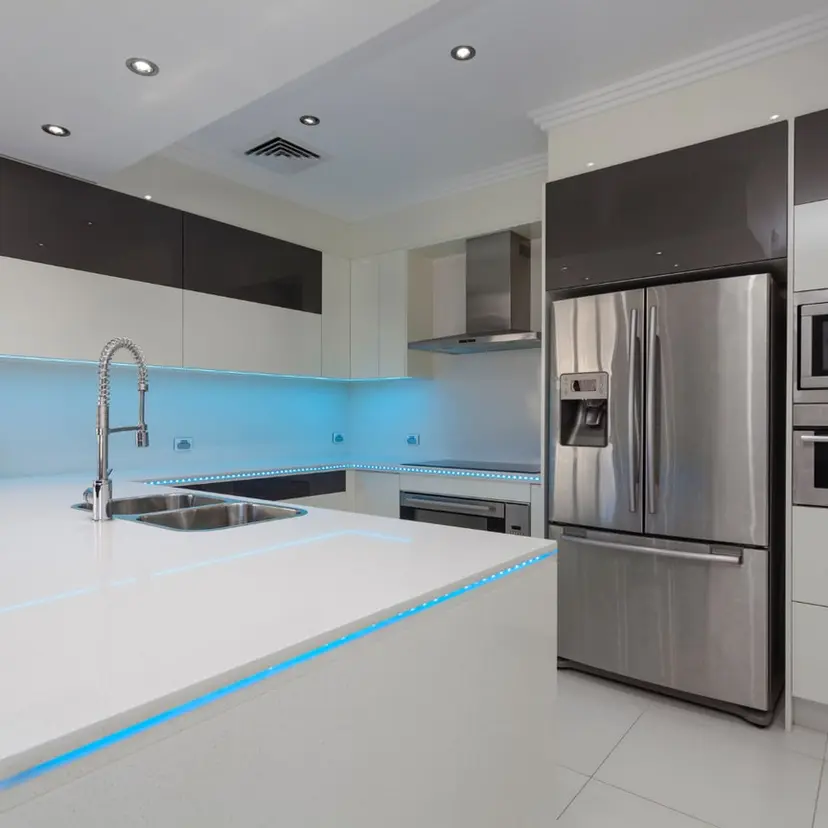 Updated white kitchen with stainless appliances in a Prairieville-area home